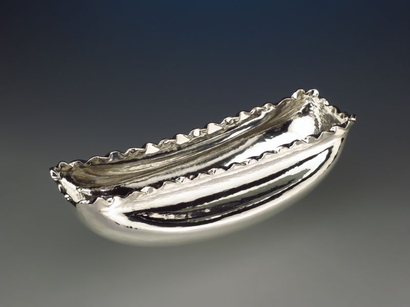 Piece -- materials: silver; dimensions: 25,5 x 11 x 8 h cm;