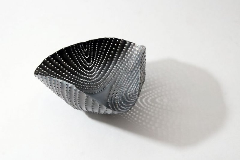Piece -- materials: silver patinated; dimensions: 15 x 7 h cm;