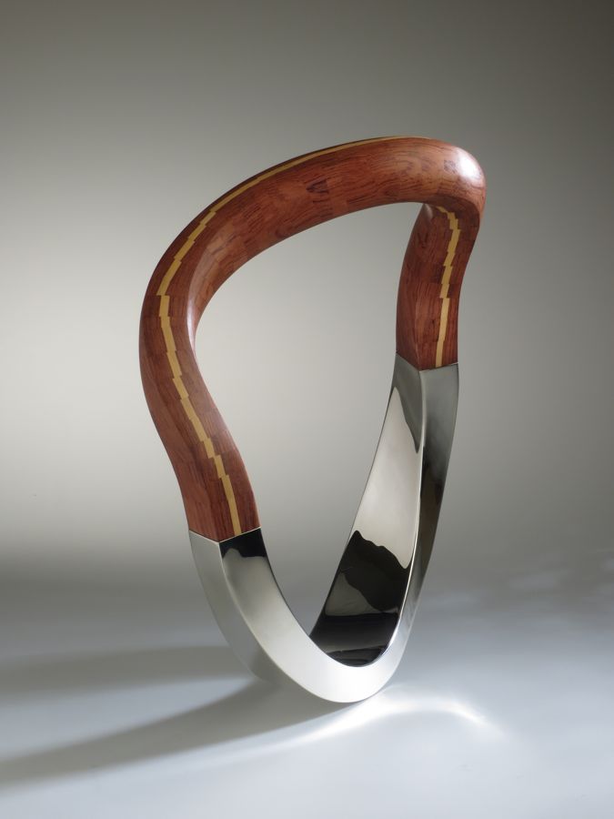 Piece -- materials: silver, bubinga, palm wood; dimensions: 30 x 15 x 37 h cm;