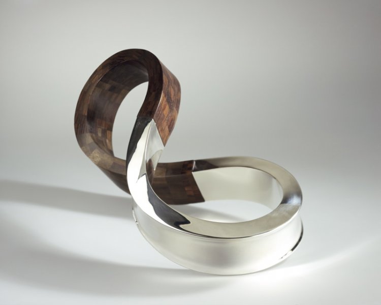 Piece -- materials: silver, palissander; dimensions: 38 x 20 x 20 cm;