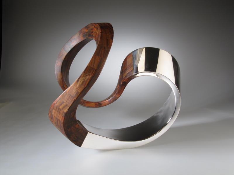 Piece -- materials: silver, palissander; dimensions: 37 x 36 x 31 h cm;