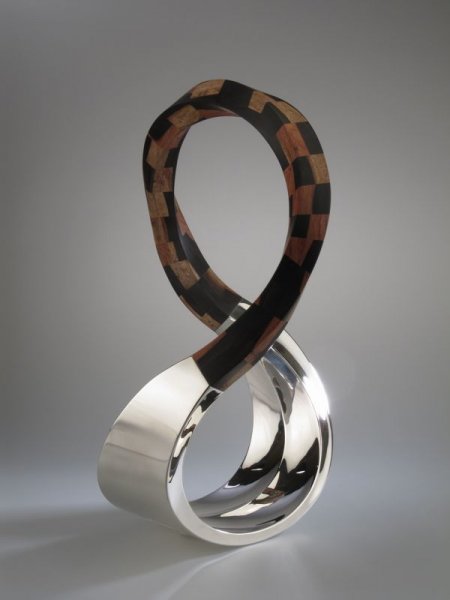 Piece -- materials: silver, bubinga, ebony; dimensions: 34 x 12 x 51 h cm;