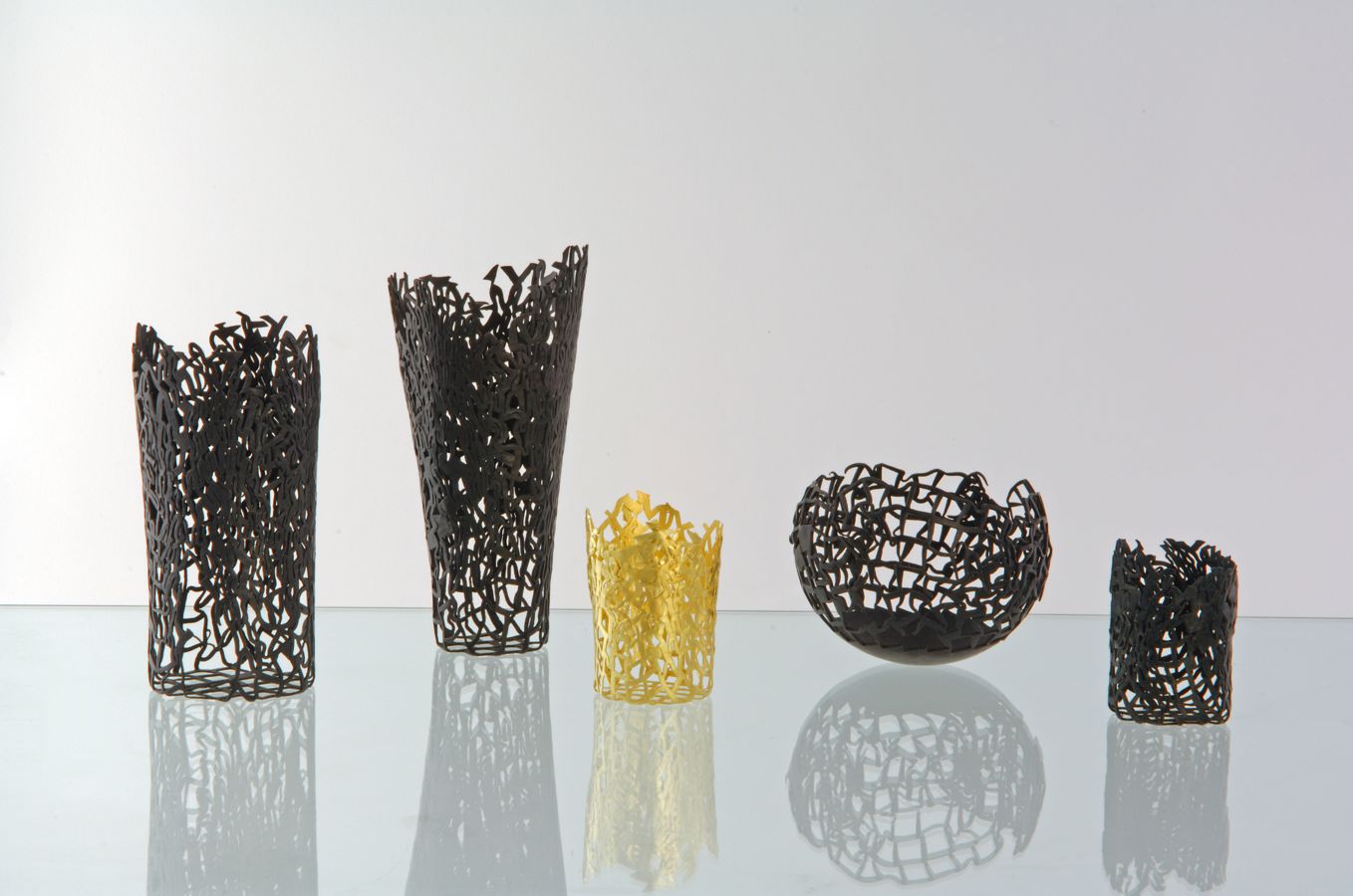 Piece -- materials: silver and copper, patinated, gold; dimensions: diameter 7, 15 h cm largest one;