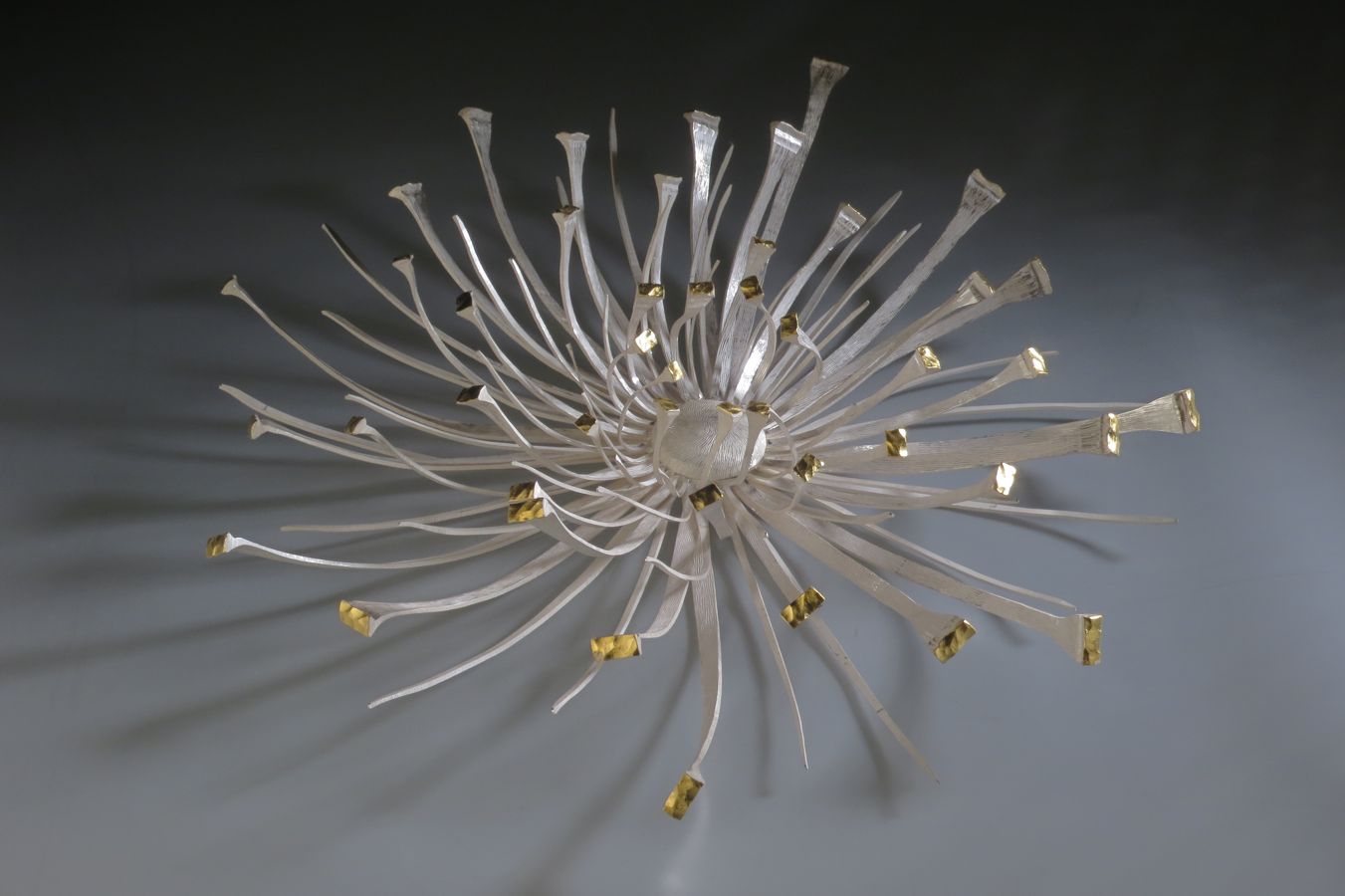 Piece -- materials: silver, gold leaf; dimensions: diameter 50 x 10 h cm;